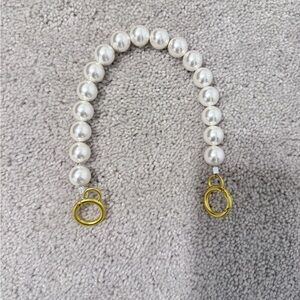 Faux pearl purse strap